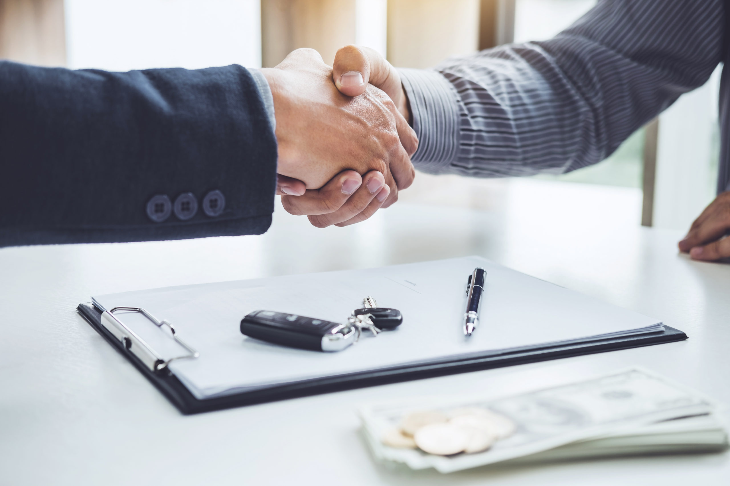 Handshake Over Car Contract